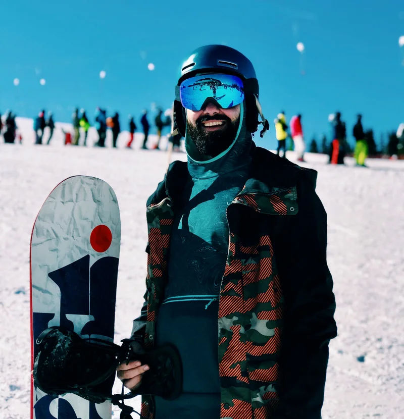 Snowboarder riding at sunset with renewed energy